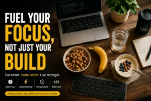 Developer snacks like nuts, fruit, and yogurt arranged next to a laptop and keyboard